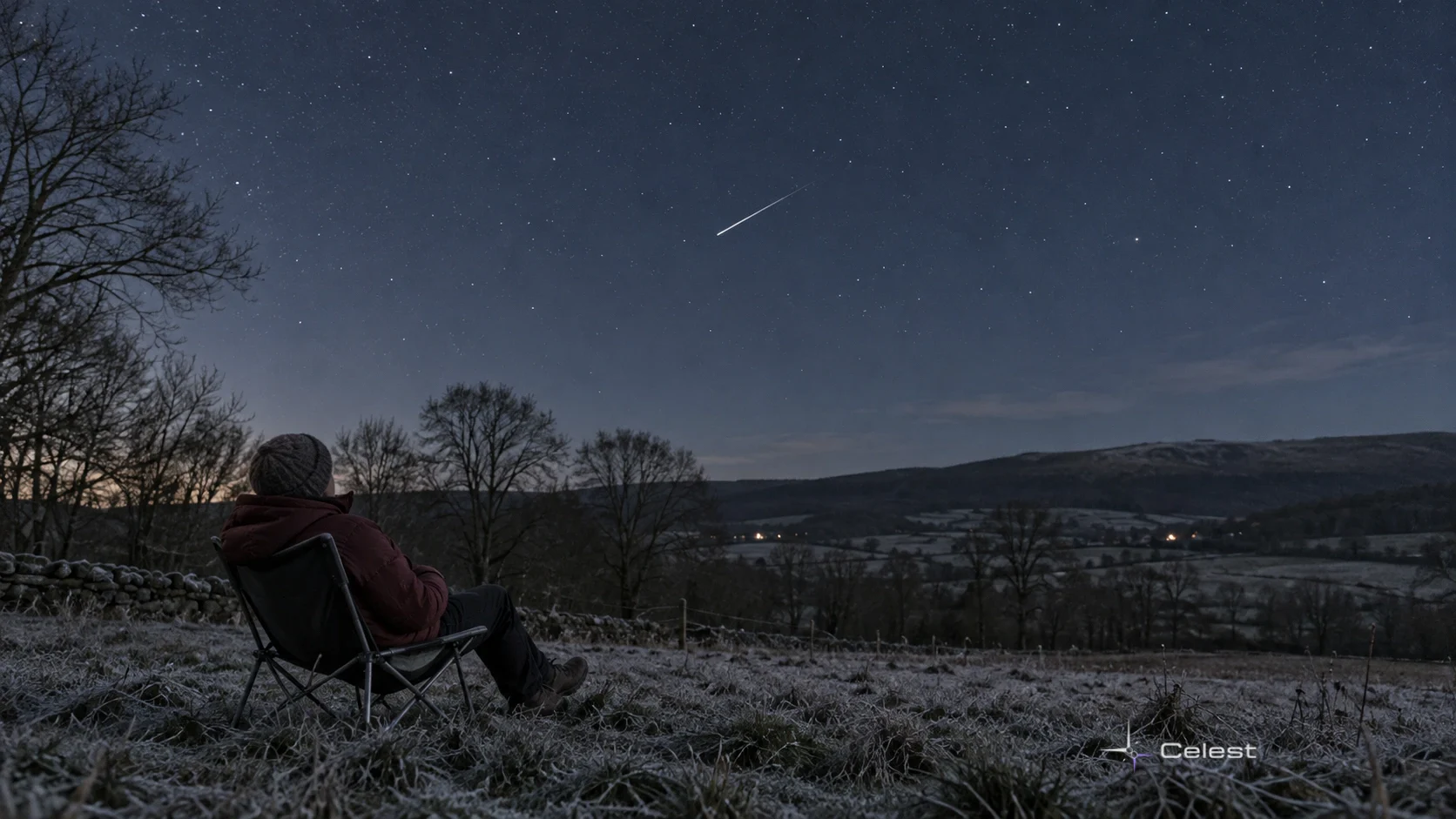 An adult in warm clothes watches one thin meteor streak above a frosty rural landscape.